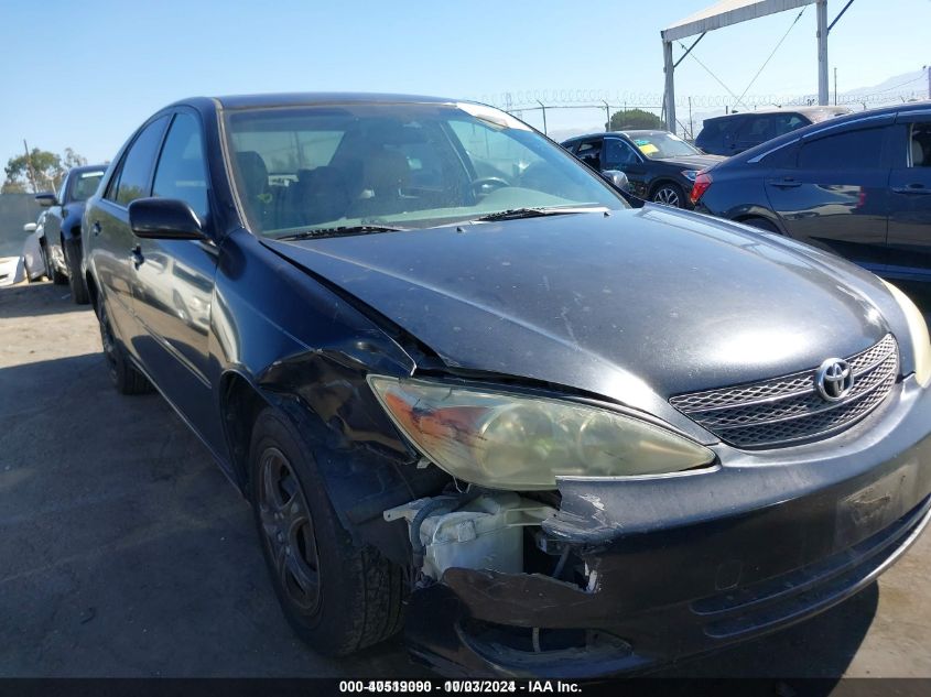 2004 Toyota Camry Le VIN: JTDBE32K040279286 Lot: 40519090