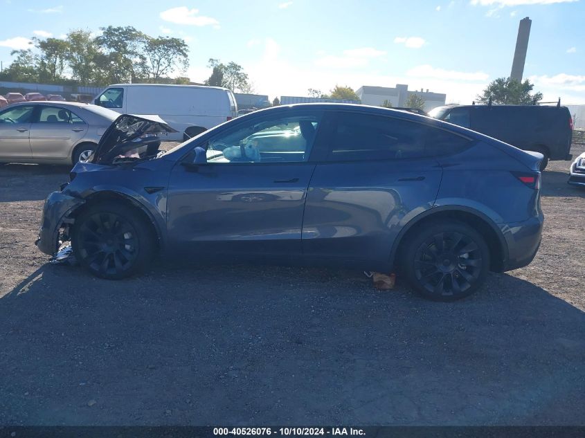 2023 Tesla Model Y Awd/Long Range Dual Motor All-Wheel Drive VIN: 7SAYGDEEXPF766262 Lot: 40526076