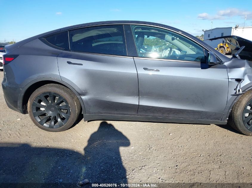 2023 Tesla Model Y Awd/Long Range Dual Motor All-Wheel Drive VIN: 7SAYGDEEXPF766262 Lot: 40526076