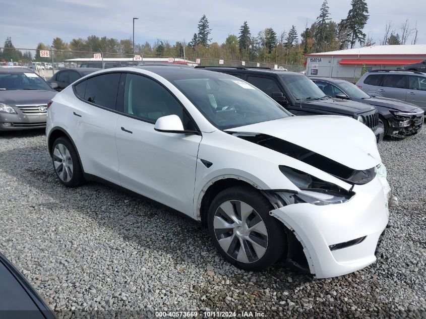 2023 Tesla Model Y VIN: 7SAYGDEE7PF825106 Lot: 40573669