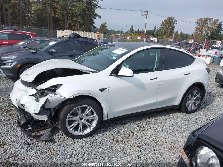 2023 Tesla Model Y VIN: 7SAYGDEE7PF825106 Lot: 40573669