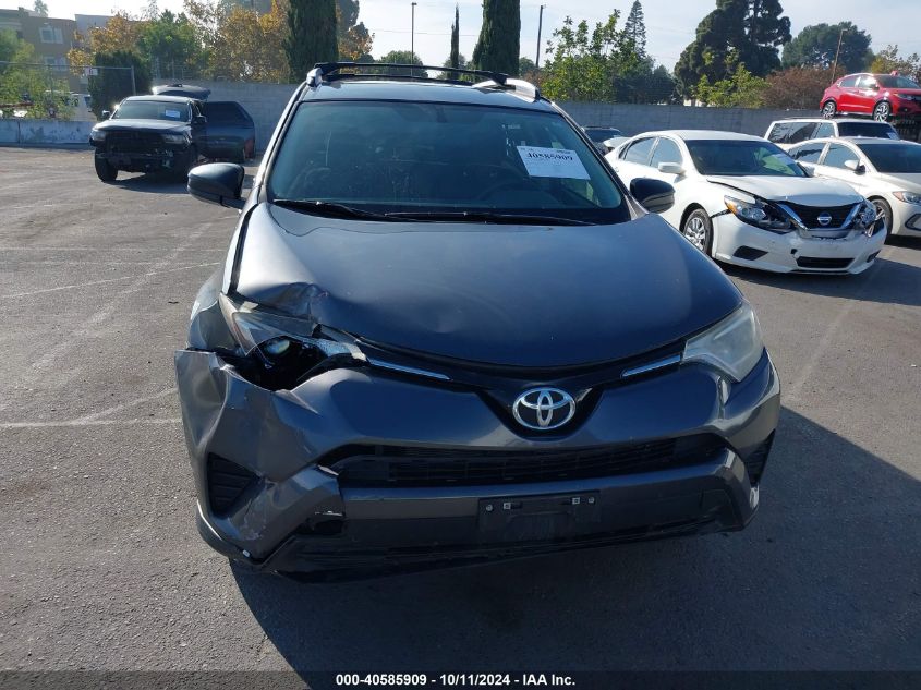 JTMBFREV7GJ100990 2016 Toyota Rav4 Le