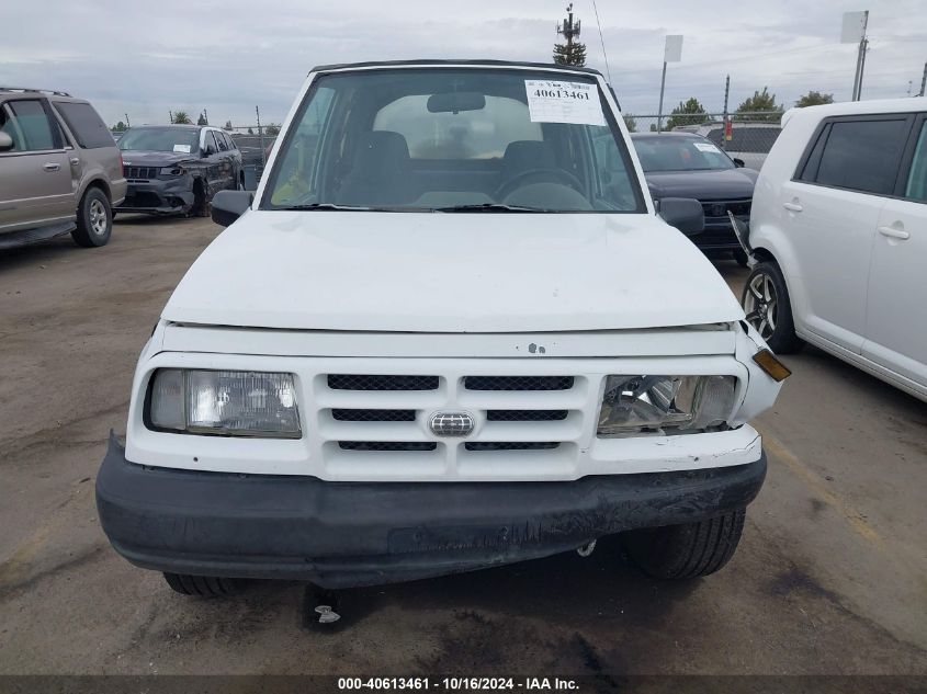 1997 Geo Tracker Softtop VIN: 2CNBE1860V6910380 Lot: 40613461