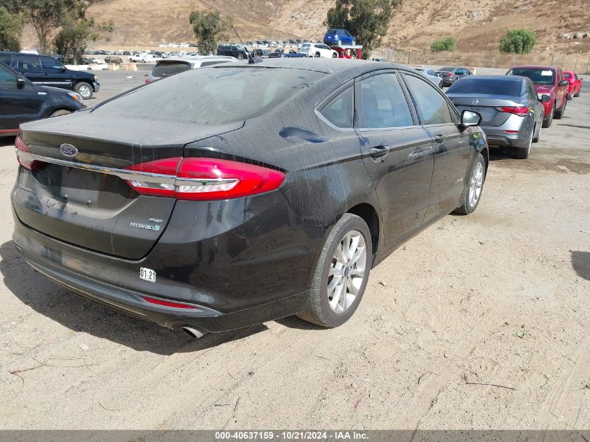 VIN YV449MDK9F2667766 2017 FORD FUSION HYBRID no.4