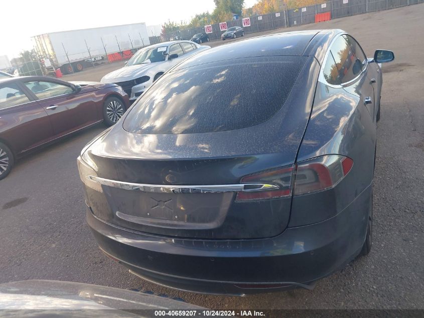 2014 Tesla Model S VIN: 5YJSA1H20EFP63677 Lot: 40659207