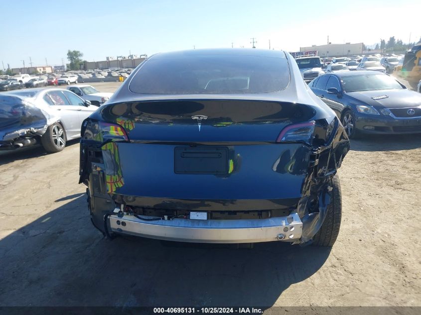 2024 Tesla Model Y Long Range Dual Motor All-Wheel Drive/Rwd VIN: 7SAYGDED9RF018063 Lot: 40695131