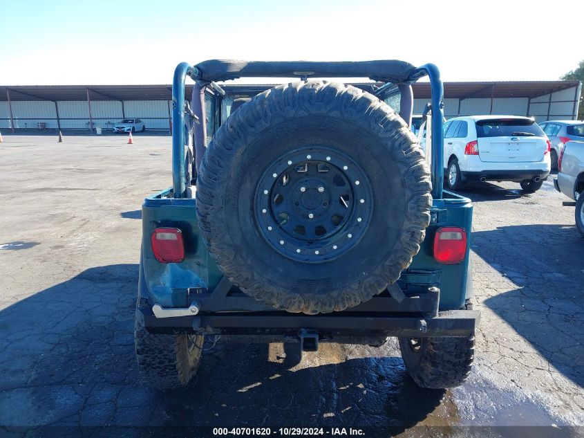 1998 Jeep Wrangler Sport VIN: 1J4FY19S9WP749810 Lot: 40701620