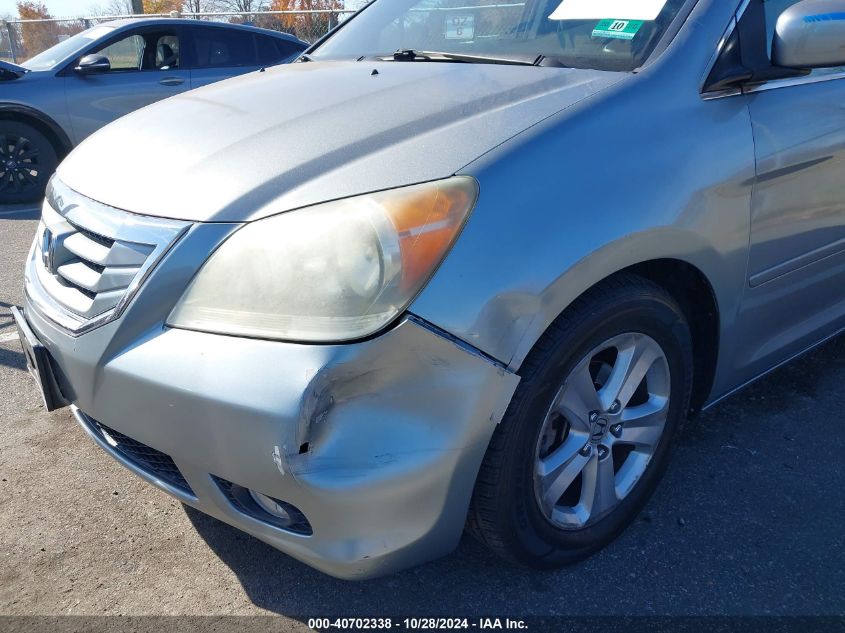 2010 Honda Odyssey Touring VIN: 5FNRL3H94AB058022 Lot: 40702338