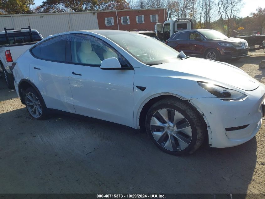 2023 Tesla Model Y Awd/Long Range Dual Motor All-Wheel Drive VIN: 7SAYGDEEXPF876275 Lot: 40715373