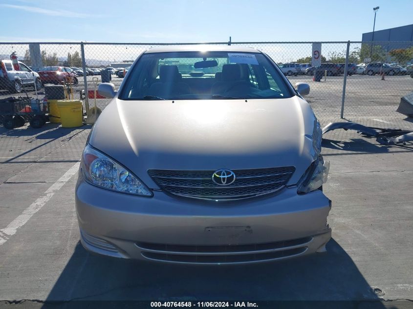 2004 Toyota Camry Le VIN: 4T1BE30K94U809892 Lot: 40764548