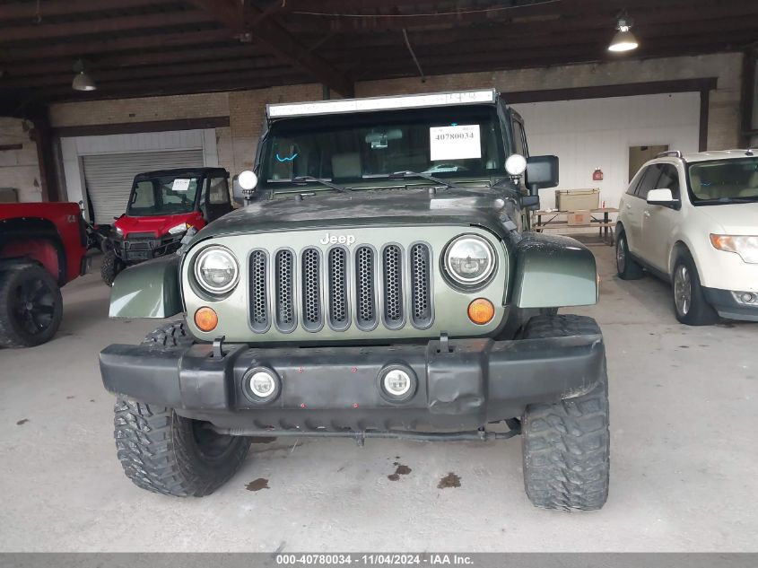 2007 Jeep Wrangler Unlimited Sahara VIN: 1J4GB59197L102319 Lot: 40780034