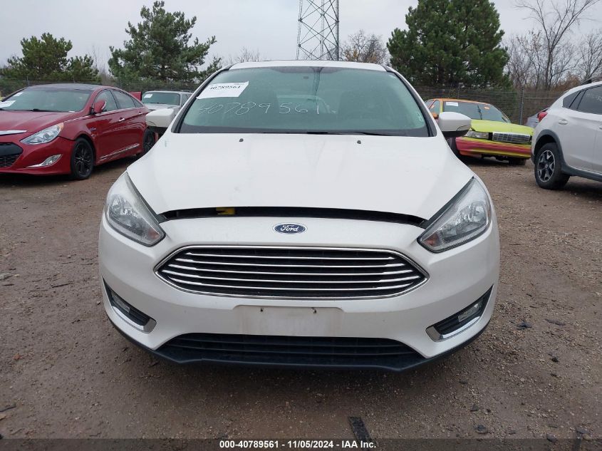 2016 Ford Focus Titanium VIN: 1FADP3N28GL242879 Lot: 40789561