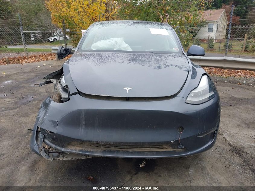 2023 Tesla Model Y Awd/Long Range Dual Motor All-Wheel Drive VIN: 7SAYGDEE5PF675299 Lot: 40795437