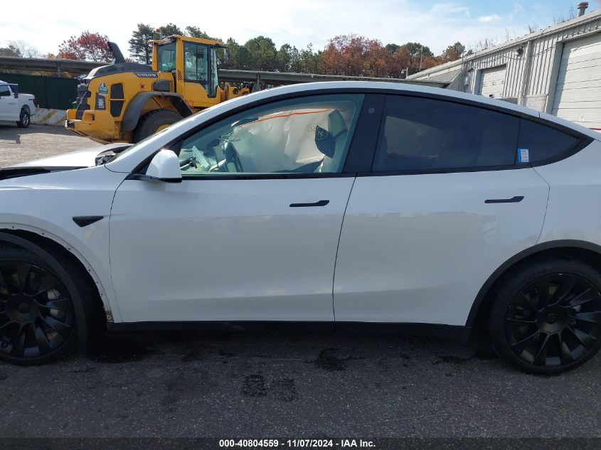 2023 Tesla Model Y Awd/Long Range Dual Motor All-Wheel Drive VIN: 7SAYGDEE3PF630734 Lot: 40804559