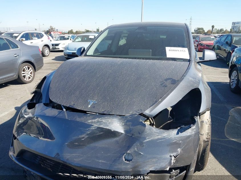 2023 Tesla Model Y Awd/Long Range Dual Motor All-Wheel Drive VIN: 7SAYGDEE9PA055942 Lot: 40809355