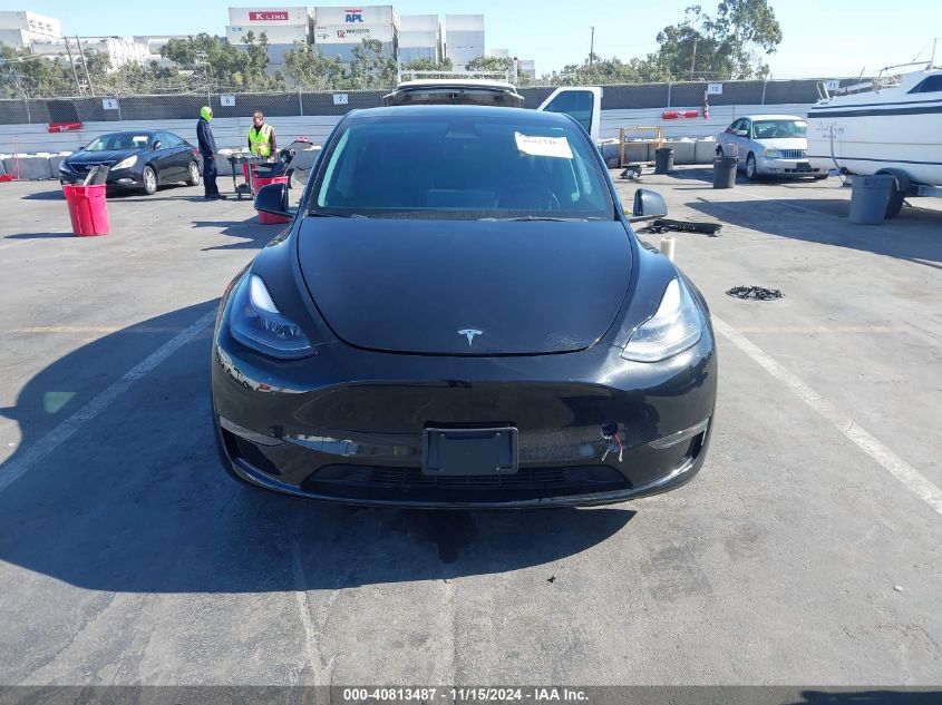 2023 Tesla Model Y Awd/Long Range Dual Motor All-Wheel Drive VIN: 7SAYGAEE8PF769580 Lot: 40813487