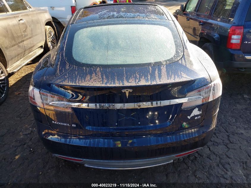 2014 Tesla Model S VIN: 5YJSA1S11EFP32325 Lot: 40823219