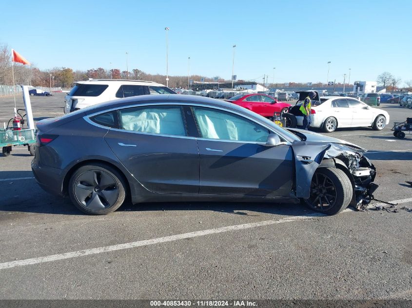 2018 Tesla Model 3 Long Range/Mid Range VIN: 5YJ3E1EAXJF025819 Lot: 40853430