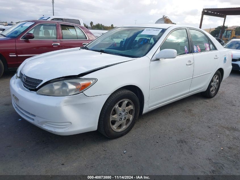 2002 Toyota Camry Le VIN: 4T1BE32K62U571834 Lot: 40873880