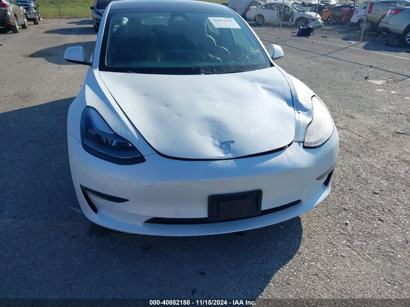 2021 Tesla Model 3 Standard Range Plus Rear-Wheel Drive VIN: 5YJ3E1EAXMF976865 Lot: 40882188