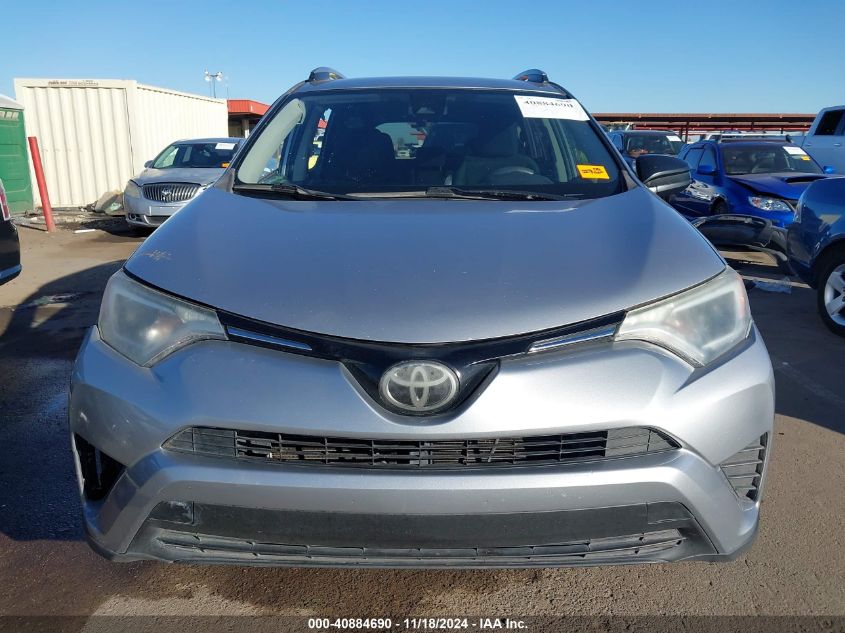 2018 Toyota Rav4 Le VIN: JTMZFREV9JD124065 Lot: 40884690