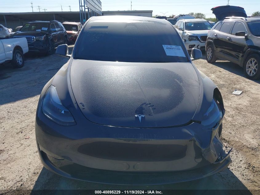 2023 Tesla Model Y Awd/Long Range Dual Motor All-Wheel Drive VIN: 7SAYGDEE9PA203264 Lot: 40895229