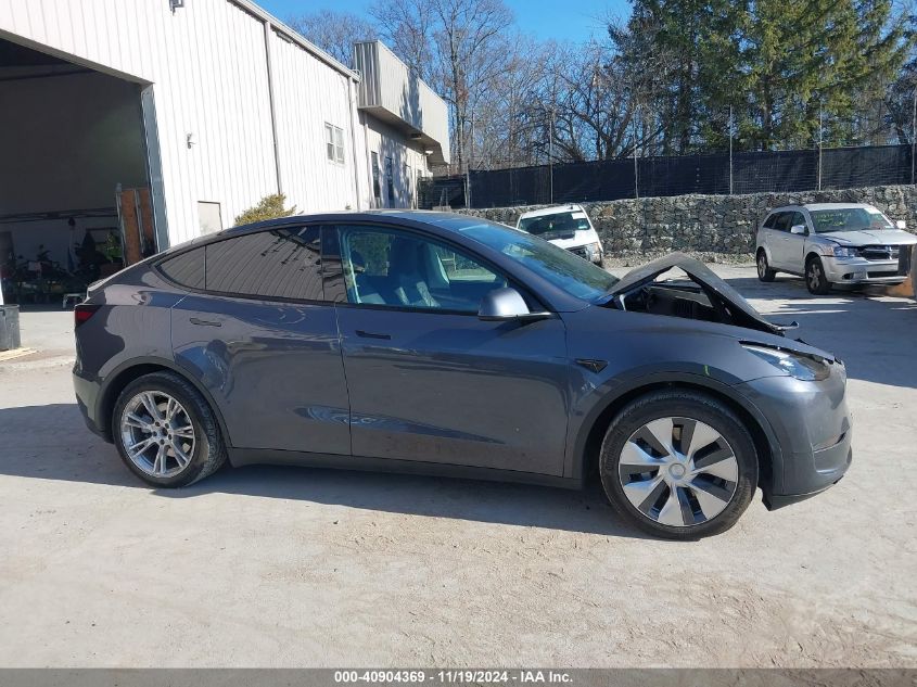 2023 Tesla Model Y Awd/Long Range Dual Motor All-Wheel Drive VIN: 7SAYGAEE1PF674004 Lot: 40904369