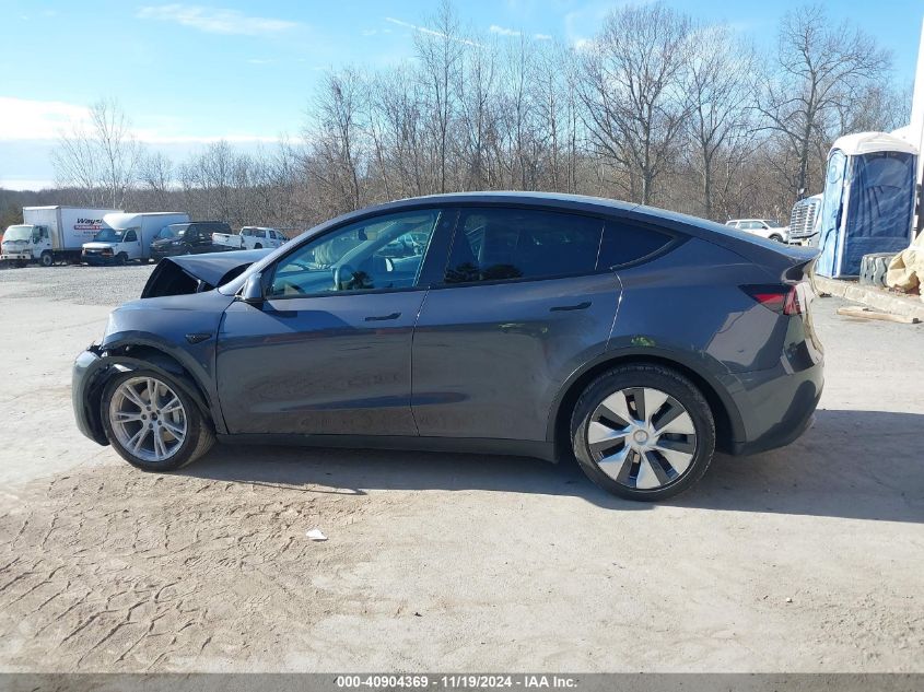 2023 Tesla Model Y Awd/Long Range Dual Motor All-Wheel Drive VIN: 7SAYGAEE1PF674004 Lot: 40904369