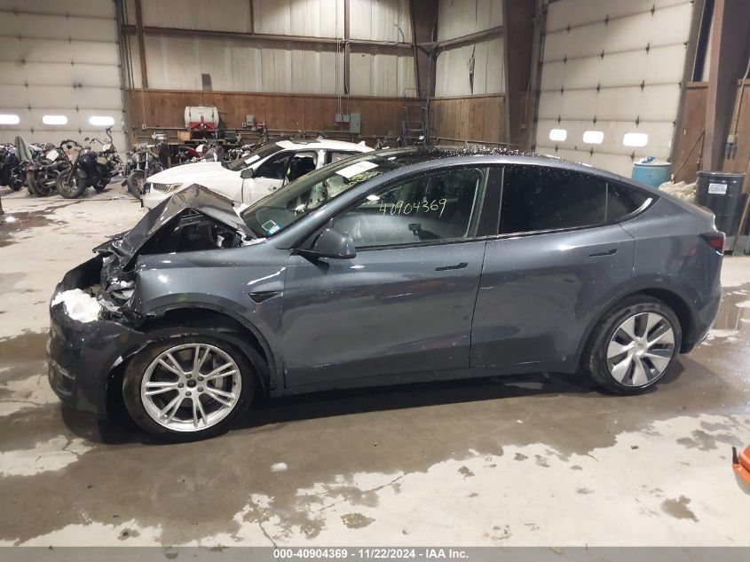 2023 Tesla Model Y Awd/Long Range Dual Motor All-Wheel Drive VIN: 7SAYGAEE1PF674004 Lot: 40904369