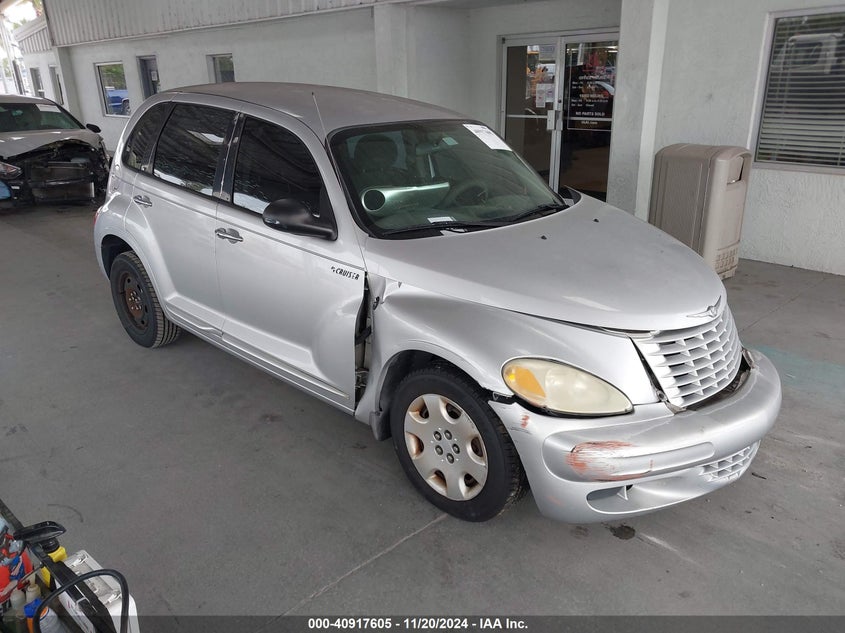 2005 Chrysler Pt Cruiser Touring silver hatchback gasoline 3C4FY58BX5T639826 photo #1