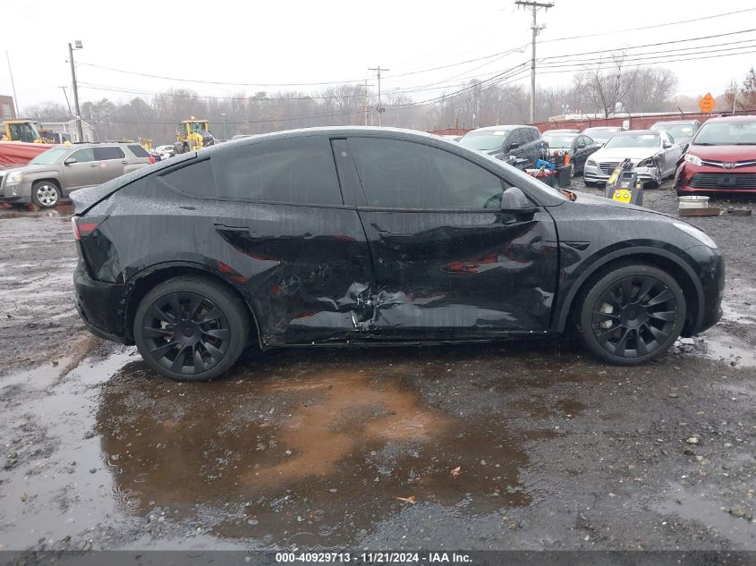 2023 Tesla Model Y Awd/Long Range Dual Motor All-Wheel Drive VIN: 7SAYGAEE8PF610509 Lot: 40929713