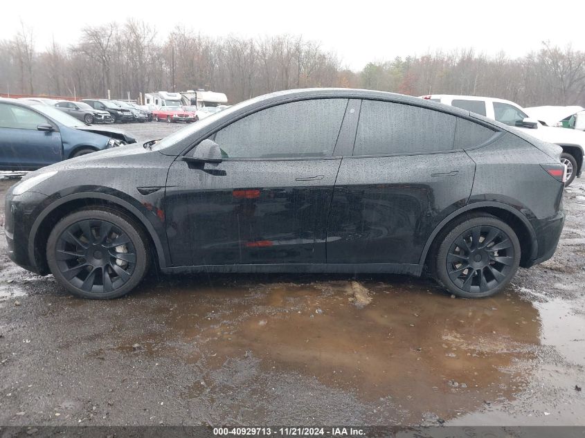 2023 Tesla Model Y Awd/Long Range Dual Motor All-Wheel Drive VIN: 7SAYGAEE8PF610509 Lot: 40929713