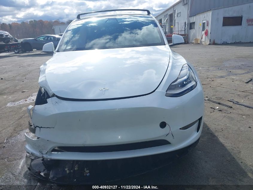 2023 Tesla Model Y Awd/Long Range Dual Motor All-Wheel Drive VIN: 7SAYGDEE9PA104184 Lot: 40932127