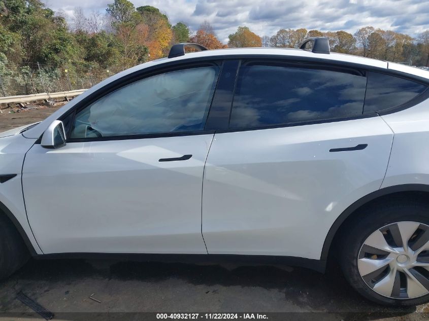 2023 Tesla Model Y Awd/Long Range Dual Motor All-Wheel Drive VIN: 7SAYGDEE9PA104184 Lot: 40932127