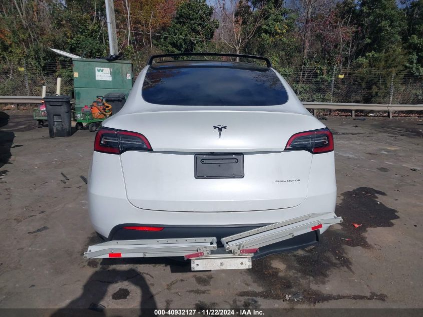 2023 Tesla Model Y Awd/Long Range Dual Motor All-Wheel Drive VIN: 7SAYGDEE9PA104184 Lot: 40932127