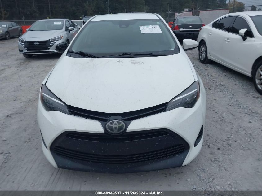 VIN 5YFBURHE4JP768377 2018 Toyota Corolla, LE no.12