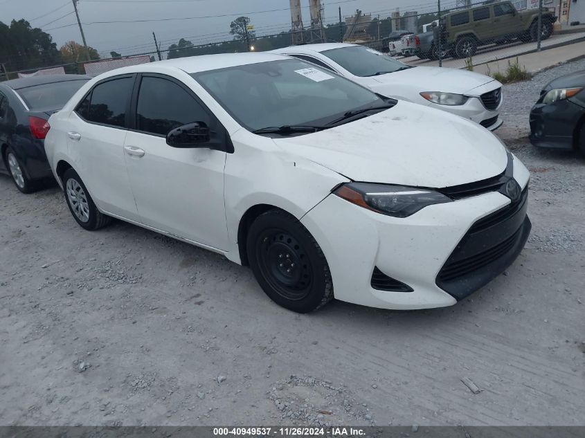 VIN 5YFBURHE4JP768377 2018 Toyota Corolla, LE no.1