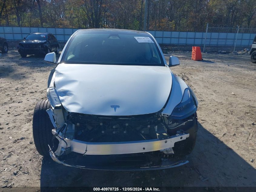 2023 Tesla Model Y Awd/Long Range Dual Motor All-Wheel Drive VIN: 7SAYGAEE1PF828338 Lot: 40978725