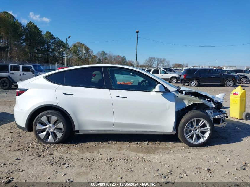 2023 Tesla Model Y Awd/Long Range Dual Motor All-Wheel Drive VIN: 7SAYGAEE1PF828338 Lot: 40978725