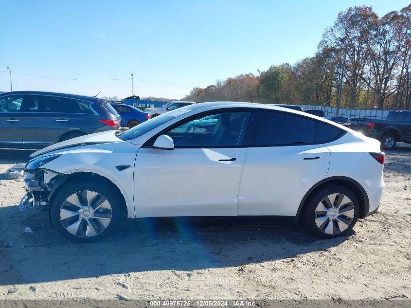 2023 Tesla Model Y Awd/Long Range Dual Motor All-Wheel Drive VIN: 7SAYGAEE1PF828338 Lot: 40978725