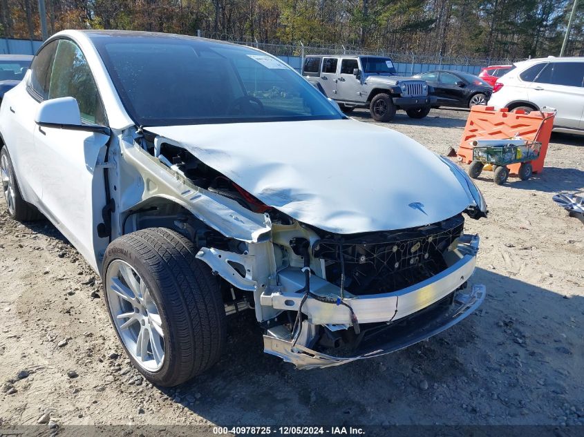 2023 Tesla Model Y Awd/Long Range Dual Motor All-Wheel Drive VIN: 7SAYGAEE1PF828338 Lot: 40978725