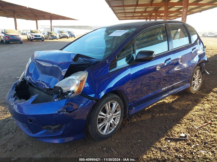 2009 HONDA FIT VIN: JHMGE886X9S008212