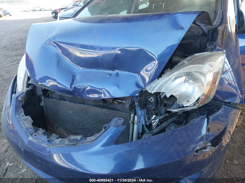 2009 HONDA FIT VIN: JHMGE886X9S008212