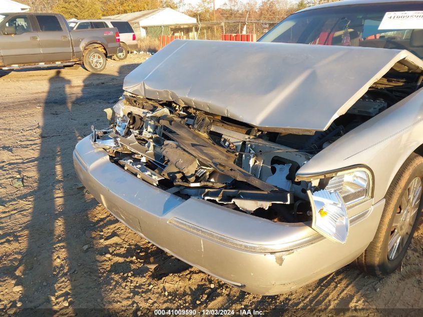 2005 Mercury Grand Marquis Gs VIN: 2MEFM74W95X671390 Lot: 41009590