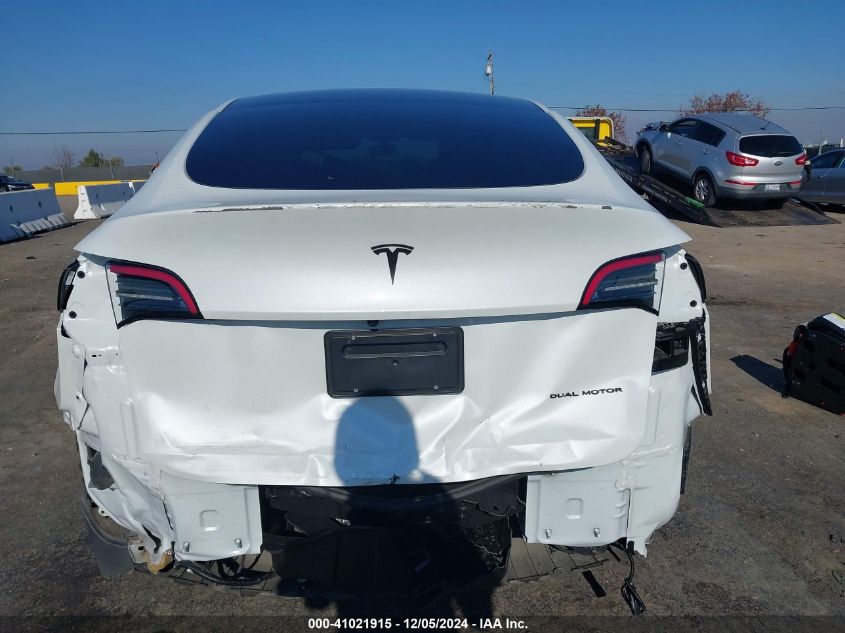 2023 Tesla Model Y Awd/Long Range Dual Motor All-Wheel Drive VIN: 7SAYGAEE0PF630933 Lot: 41021915