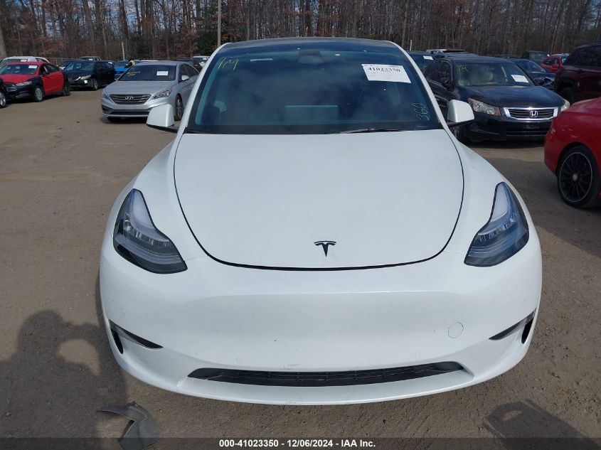 2023 Tesla Model Y Awd/Long Range Dual Motor All-Wheel Drive VIN: 7SAYGAEE1PF584061 Lot: 41023350