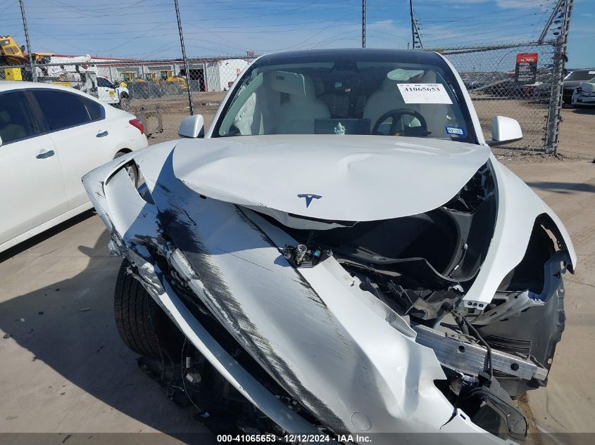 2023 Tesla Model Y Awd/Long Range Dual Motor All-Wheel Drive VIN: 7SAYGAEEXPF663809 Lot: 41065653