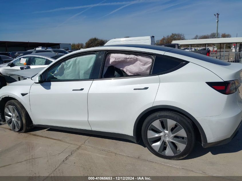 2023 Tesla Model Y Awd/Long Range Dual Motor All-Wheel Drive VIN: 7SAYGAEEXPF663809 Lot: 41065653