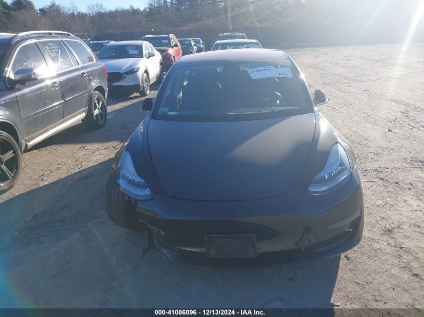 2018 Tesla Model 3 VIN: 5YJ3E1EB7JF128057 Lot: 41086096