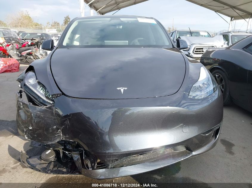 2025 Tesla Model Y Long Range Dual Motor All-Wheel Drive VIN: 7SAYGDED6SF229498 Lot: 41086718